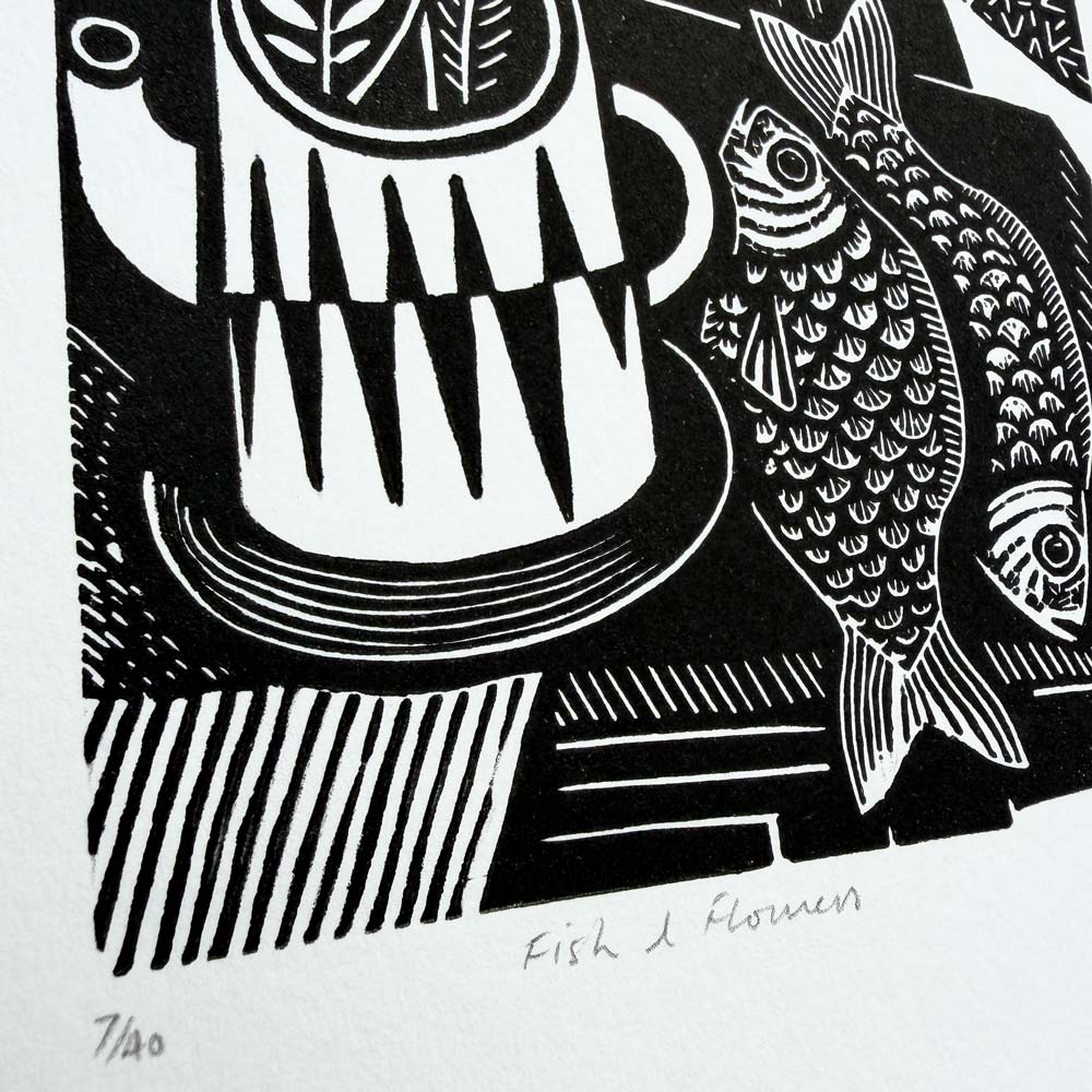 Graphic abstract Black and white still life linocut print showing flowers in a vase surrounded by textures and fish