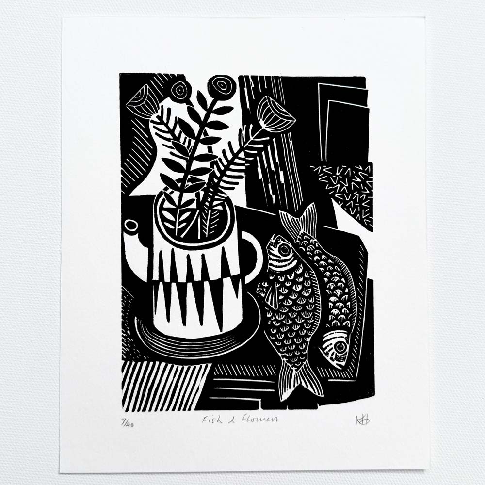 Graphic abstract Black and white still life linocut print showing flowers in a vase surrounded by textures and fish